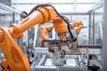 view of robotic arms and mechanical hands assembling complex machines