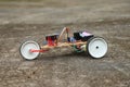 View of a robotic car having 3 wheels. Robot car that is controlled using a programmable micro controller board working prototype