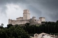 View of Rocca Maggiore of Assisi with background of incoming storm