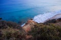 View on the rock and the ocean with blue water Royalty Free Stock Photo