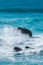 View of rock with waves breaking on the beach of Liencres, Cantabria, Spain Royalty Free Stock Photo