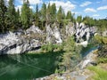 View of the rocks and the emerald water of the Marble Canyon in the Ruskeala Mountain Park, which reflects the sky and rocks on a Royalty Free Stock Photo