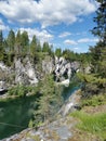 View of the rocks and the emerald water of the Marble Canyon in the Ruskeala Mountain Park, which reflects the sky and rocks on a Royalty Free Stock Photo