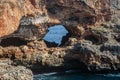 View on rocks with hole and deep blue sea.Mallorca Island, Spain Royalty Free Stock Photo