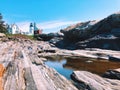 A view from the rocks of Pemaquid Point Lighthouse Royalty Free Stock Photo