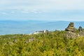 Rocks and Shad Tchup Ling Buddhist monastery on mountain Kachkanar. The Urals. Russia