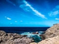 View of the rocky coast with breaking waves Royalty Free Stock Photo