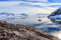 View from the rocky coast to the Neco bay surrounded by glaciers