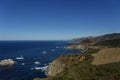 View of the rocky coastline of Big Sur, California on the Pacific Ocean under a blue sky Royalty Free Stock Photo
