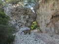 A view of rocky hiking trail to Cala Goloritze beach, path between two limestone rocks. Famous travel destination. Gulf Royalty Free Stock Photo