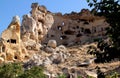 View of a rocky mountain with holes in the town of Ãavu?in, Cappadocia, Turkey Royalty Free Stock Photo