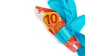 View of rolled 10 euro banknotes with blue ribbon Royalty Free Stock Photo