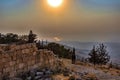 View of a rolling mountain landscape with trees and fog at sunset, called Mount Nebo in Jordan, where the Bible, God showed Moses