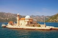 View of Church of Our Lady of the Rocks on a sunny summer day. Bay of Kotor, Montenegro. Free space for text Royalty Free Stock Photo