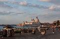 Venice, Italy - February 18, 2020 : A view of the Roman Catholic Santa Maria Della Salute Church and on the left side few people f Royalty Free Stock Photo