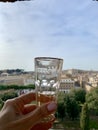 View of roman sights through a glass of prosecco