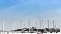 View on the roof of a building of a large air conditioning equipment with cable-suspended Swooping Rooftop Pylon Anchors, Pale