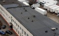 View of the roof of a commercial building cars and semi-trailers Royalty Free Stock Photo