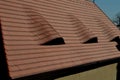 View of the roof made of red brick burnt tiles of the beaver type used in Central Europe on all historical roofs, especially in Au Royalty Free Stock Photo