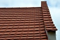 View of the roof made of red brick burnt tiles of the beaver type used in Central Europe on all historical roofs, especially in Au Royalty Free Stock Photo