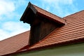 View of the roof made of red brick burnt tiles of the beaver type used in Central Europe on all historical roofs, especially in Au Royalty Free Stock Photo