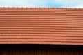 View of the roof made of red brick burnt tiles of the beaver type used in Central Europe on all historical roofs, especially in Au Royalty Free Stock Photo