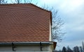 View of the roof made of red brick burnt tiles of the beaver type used in Central Europe on all historical roofs, especially in Au Royalty Free Stock Photo