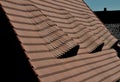 View of the roof made of red brick burnt tiles of the beaver type used in Central Europe on all historical roofs, especially in Au Royalty Free Stock Photo