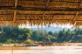 View of the roof from the reeds on the river Nam Khan, Luang Prabang, Laos. Copy space for text. Royalty Free Stock Photo