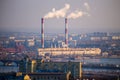 View from the roof to power station with pipes of which poured smoke on a river Royalty Free Stock Photo