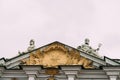 View of the roof of the Winter Palace with sculptures from the side of the Dvortsovaya Embankment.