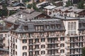 View of the roofs of chalets in a Swiss resort. A place preserving authentic architecture. Natural stone roofs, wooden