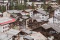 View of the roofs of chalets in a Swiss resort. A place preserving authentic architecture. Natural stone roofs, wooden