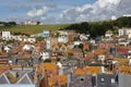 View of the roofs of Hastings old town from East Hill with West Hill in the background and beautiful clouds, Hastings, UK
