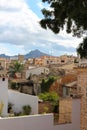 View of the roofs of houses in Alcudia against a cloudy sky. Alcudia. Majorca. Spain