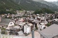 View of the roofs of houses in a Swiss resort. A place preserving authentic architecture. Natural stone roofs, wooden