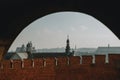 The view of the roofs of houses and towers of churches of the Poland city of Krakow behind the wall of city`s castle