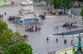 Rossio Square, the Column of Pedro IV, the Queen Maria II National Theatre, fountain and the orange rooftops from Royalty Free Stock Photo