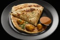 View of roti canai and chicken curry. Roti Canai and chicken curry is a great meal to share with friends and family, as it can