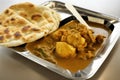 View of roti canai and chicken curry. Roti Canai and chicken curry is a great meal to share with friends and family, as it can