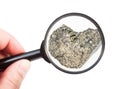 View of rough peridotite rock through magnifier