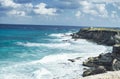 A view of rough sea water splashing against the rocks in Isla isla mujeres near Cancun, Mexico Royalty Free Stock Photo