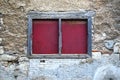 Roughly closed window on a worn wall Royalty Free Stock Photo