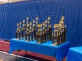 View at rows of gymnastic competition trophies on the table Royalty Free Stock Photo