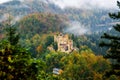 Hohenschwangau Castle surrounded by a colorful autumn forest Royalty Free Stock Photo