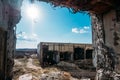 View at ruined building after war through broken wall of another house Royalty Free Stock Photo