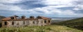 View of a ruined house on top of a hill on a cloudy day background Royalty Free Stock Photo