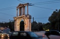 View of the Ruins of archway Hadrians Arch Temple Olympian Zeus Athens during sunset with colorful light trace from night traffic Royalty Free Stock Photo