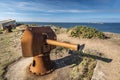 View from ruins of Beniguet bastion in Beg er Vachif peninsula in west of Houat island, old rusted canon is at foreground. French Royalty Free Stock Photo