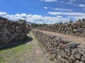 View of ruins of an Inca-era stone citadel undergoing conservation by authorities Royalty Free Stock Photo